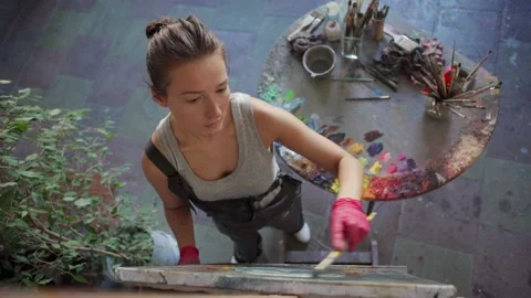 Painter creating artwork on canvas with oil paints Stock Footage 142669831