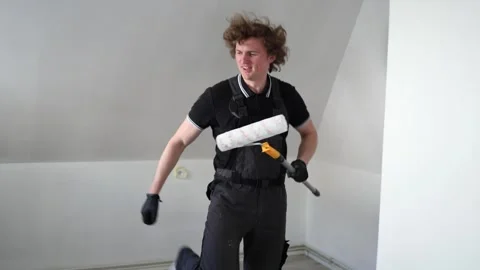 Painter dancing after renovation finished Stock Footage 335046648