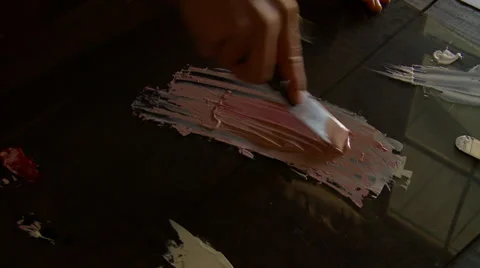 Painter Demonstrating a Paint Stroke on a White Piece of Paper 스톡 동영상 33057237