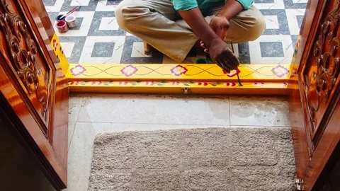 Painter design leaf on doorstep at residential home, hyderabad, telangana Stock Footage 335022528