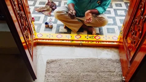 Painter Designing leaf on doorstep decoration at residential home, hyderabad Stock Footage 336183095