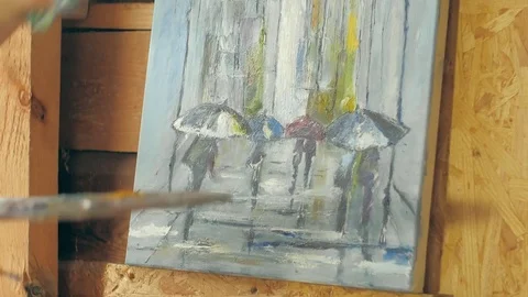 Painter does a picture on canvas Stock Footage 72717935