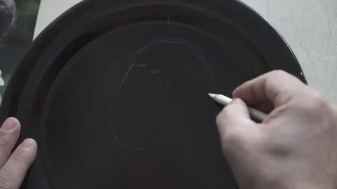 A painter is drawing human silhouette on pot. 4K Footage in Turkey Stock Footage 147444453