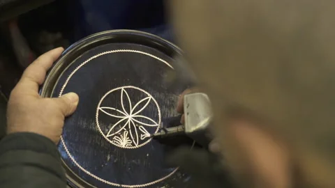 A painter is drawing human silhouette on pot. 4K Footage in Turkey Stock Footage 161090901