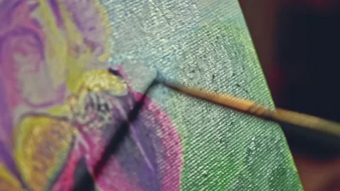 Painter draws on canvas with brush Stock Footage 166093636
