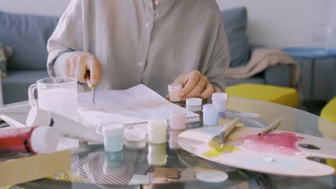 Painter draws in sketchbook at table Stock Footage 169012102