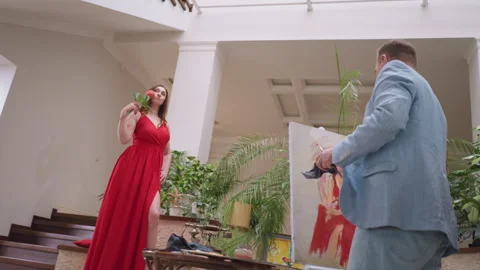 Painter entranced by charm of live model Stock Footage 265057546