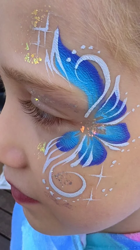 Painter hand draws face painting to little girl. Aqua makeup. Children party. Stock Footage 310651153