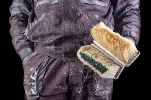 Painter holding a wall brush in his hand. Accessories for small home repairs. Stock Photos