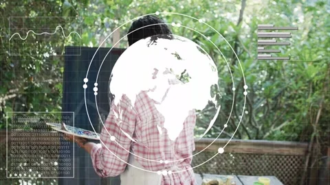 Painter lifting brush on start, AR HUD building globe and charts, visualizing Stock Footage 333478095