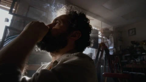 Painter Lost in Thought Smoking Cigarette during Mental Burnout in Studio Stock Footage 334685186