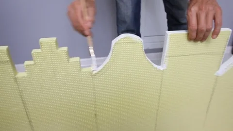 Painter is making the decoration. Making the toy buildings for kids Stock Footage 70785819