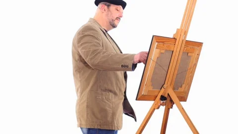 Painter making picture white screen dolly shot Stock Footage 105011565