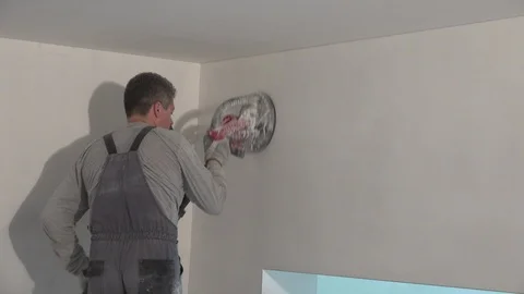 Painter man with grinder machine polishing wall. zoom out Stock Footage 126726749