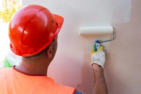 Painter Man in Helmet at Work Stock Photos