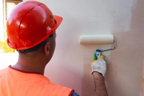 Painter Man in Helmet at Work Stock Photos