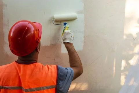 Painter Man in Helmet at Work Stock Photos