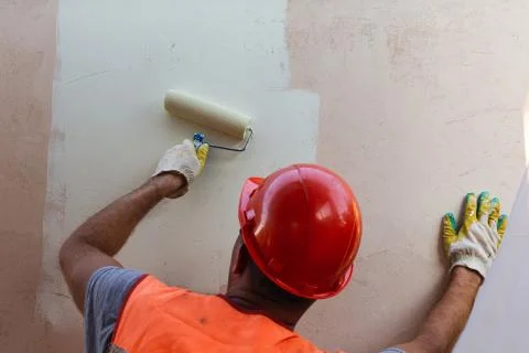 Painter Man in Helmet at Work Stock Photos