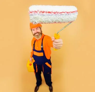 Painter man with paint roller and canister. Interior design, decoration conce 写真素材