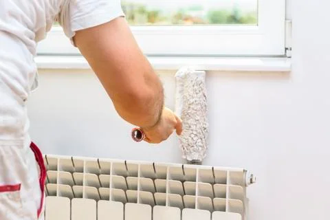 Painter man at work with a roller Stock Photos