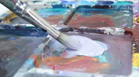 Painter mixes paint on the palette Stock Footage 61571736