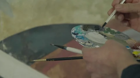 Painter mixing colours on palette, close up Stock Footage 267849804