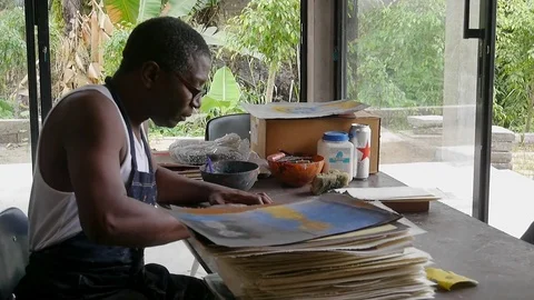 Painter Mpah Dooh Joël working in his studio Stock Footage 80956606