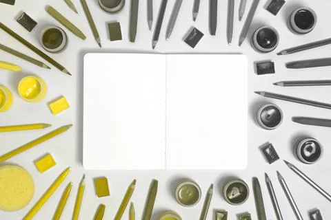 Painter notebook with yellow and gray tools Stock Photos