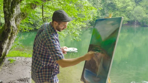 Painter painting in the forest. Video stock 212266207