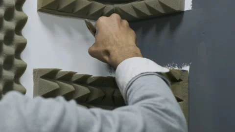 Painter painting studio corner wall with grey paint with a brush Stock Footage 220714263