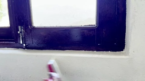 Painter Painting Window and Wall of Newly Constructed House Stock Footage 339530349