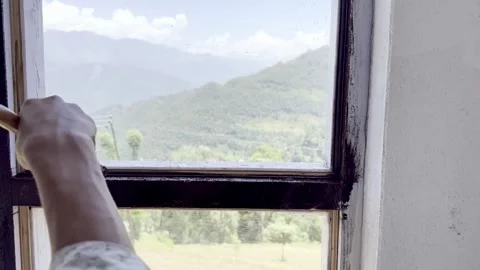 Painter Painting Window and Wall of Newly Constructed House Stock Footage 339530412