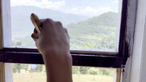 Painter Painting Window and Wall of Newly Constructed House Stock Footage 339530440