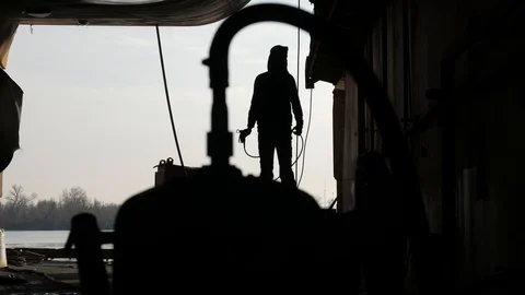 The painter paints the bottom of the ship Stock-Footage 87085804