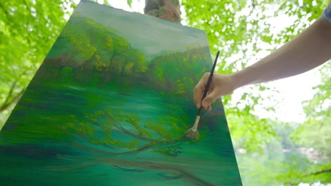 The painter paints in the forest. Stock Footage 212279833