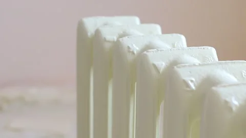 The painter paints a heating battery with a brush Stock Footage 135838839