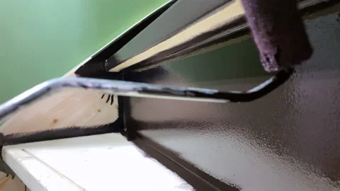Painter paints stairs with a paint roller Video stock 201959281