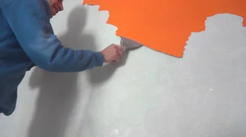 Painter peeling off old paint from wall 스톡 동영상 48384843