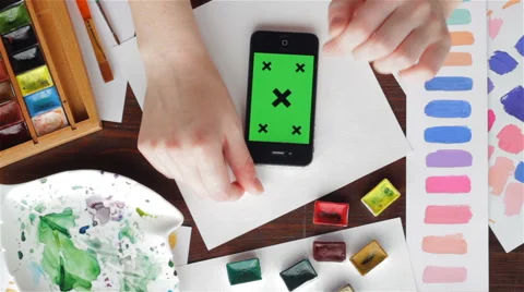 Painter with phone Stockbeeldmateriaal 64205599