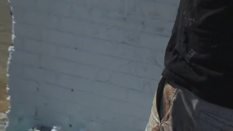 Painter puts on hat Stock Footage 74589380