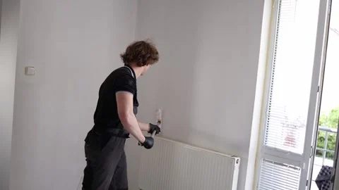 Painter refreshing apartment interior walls 스톡 동영상 335046935