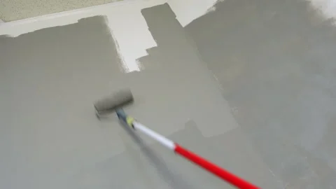 Painter Rolling Gray Paint on Wall Stock Footage 295489344
