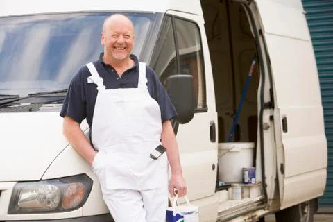 Painter standing with van smiling Stock Photos