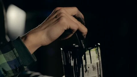 Painter Stirring a Black Paint in a Jar. Видео 86236528