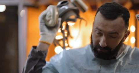 Painter taking off his protective mask Stock Footage 147273441