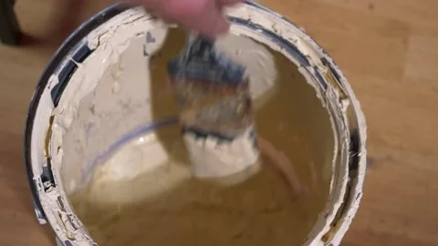 Painter with tin of paint and brush Stock Footage 161817354