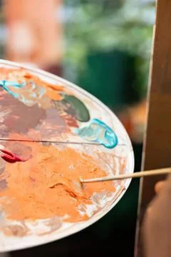 Painter using colorful palette with brush Stock Photos
