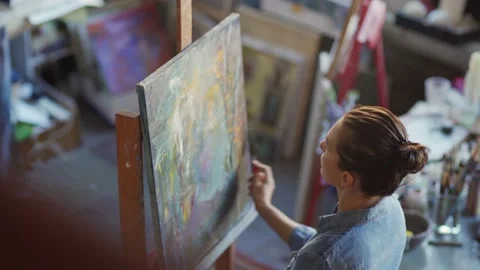 Painter using palette knife to create abstract portrait Video stock 142670321