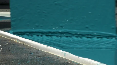 Painter using trowel to spread epoxy paint resin on floor surface 스톡 동영상 123725267