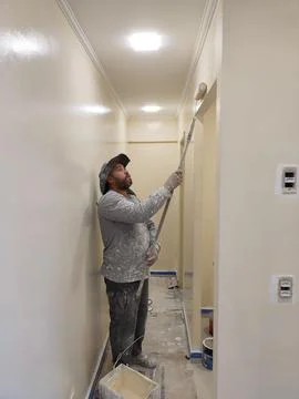Painter Working in Corridor Stock Photos